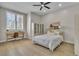 Bedroom with a work desk, neatly made bed, and a light fixture on the ceiling at 8848 Rainbow Ridge Dr, Las Vegas, NV 89117