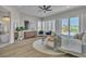 Bright primary bedroom with bed, dresser and access to a balcony with neighborhood views at 8848 Rainbow Ridge Dr, Las Vegas, NV 89117