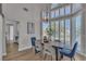 Dining room with lots of natural light from windows and a decorative light fixture over the table at 8848 Rainbow Ridge Dr, Las Vegas, NV 89117