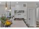 Modern kitchen featuring an island with pendant lights, stainless steel appliances, and mosaic backsplash at 8848 Rainbow Ridge Dr, Las Vegas, NV 89117