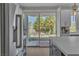 Bright kitchen with stainless steel appliances and view of patio at 8848 Rainbow Ridge Dr, Las Vegas, NV 89117