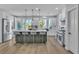 Bright open kitchen with a large island with seating and stainless steel appliances at 8848 Rainbow Ridge Dr, Las Vegas, NV 89117