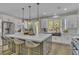 Spacious kitchen with an island with seating and stainless steel appliances at 8848 Rainbow Ridge Dr, Las Vegas, NV 89117
