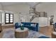 Elegant living room featuring a staircase, hardwood floors, and modern decor at 8848 Rainbow Ridge Dr, Las Vegas, NV 89117