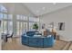 Spacious living room showcasing vaulted ceilings, large windows, and modern decor at 8848 Rainbow Ridge Dr, Las Vegas, NV 89117