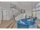 Open-concept living space featuring a staircase, high ceilings and abundant natural light at 8848 Rainbow Ridge Dr, Las Vegas, NV 89117