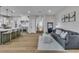 Open-concept living room featuring a kitchen with an island and a comfortable seating area at 8848 Rainbow Ridge Dr, Las Vegas, NV 89117