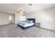 Spacious bedroom with a plush bed, neutral carpet, ceiling fan, and bright natural light at 9124 Sapphire Ridge Ave, Las Vegas, NV 89129