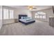 Bright bedroom with a plush bed, natural light from the window, and a ceiling fan at 9124 Sapphire Ridge Ave, Las Vegas, NV 89129