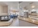 Open kitchen with granite counters, stainless appliances, a cozy breakfast nook, and a fireplace at 9124 Sapphire Ridge Ave, Las Vegas, NV 89129
