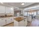Bright, spacious kitchen with granite countertops, an island, and an adjacent dining area with ample natural light at 9124 Sapphire Ridge Ave, Las Vegas, NV 89129