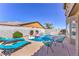 Backyard pool and spa with lounge chairs and playful unicorn and flamingo floats at 9124 Sapphire Ridge Ave, Las Vegas, NV 89129