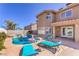 Inviting backyard oasis featuring a sparkling pool, lounge chairs, and a lush garden, perfect for relaxation and entertainment at 9124 Sapphire Ridge Ave, Las Vegas, NV 89129
