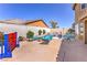 Enjoy a backyard featuring a sparkling pool, lounge chairs, and mature landscaping, creating a private outdoor oasis at 9124 Sapphire Ridge Ave, Las Vegas, NV 89129