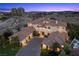 Stunning aerial view showcases a luxury home, landscaping, and city skyline at 9301 Verlaine Ct, Las Vegas, NV 89145