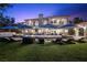 Luxury home with a sparkling pool, lounge chairs, and manicured lawn creating an inviting outdoor oasis at 9301 Verlaine Ct, Las Vegas, NV 89145