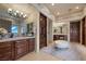 Elegant bathroom with dual vanities, custom cabinetry, and luxurious finishes offering a spa-like experience at 9301 Verlaine Ct, Las Vegas, NV 89145