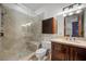 Bathroom with tiled shower, vanity with marble countertop, and a medicine cabinet at 9301 Verlaine Ct, Las Vegas, NV 89145