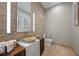Stylish powder room featuring modern fixtures, artistic decor, and unique glass vessel sink at 9301 Verlaine Ct, Las Vegas, NV 89145