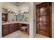 Stylish bathroom showcasing a spacious vanity, elegant lighting, and sophisticated design elements at 9301 Verlaine Ct, Las Vegas, NV 89145
