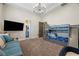 Bright bedroom with blue bunkbeds and a couch with blue decorative pillows at 9301 Verlaine Ct, Las Vegas, NV 89145