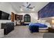 Bedroom boasts coffered ceilings, a dark blue accent wall, and desk area at 9301 Verlaine Ct, Las Vegas, NV 89145