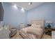 Bedroom features a blue accent wall, queen bed, and neutral furniture at 9301 Verlaine Ct, Las Vegas, NV 89145