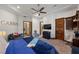 Bedroom features a ceiling fan, work space, and a large bed at 9301 Verlaine Ct, Las Vegas, NV 89145
