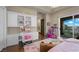 Spacious bedroom features a vanity, hardwood floors, custom decor, and a private balcony at 9301 Verlaine Ct, Las Vegas, NV 89145