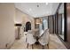 Refined dining room with marble floors, modern lighting, and elegant dining set at 9301 Verlaine Ct, Las Vegas, NV 89145