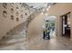 Grand staircase and luxurious foyer with decorative lighting at 9301 Verlaine Ct, Las Vegas, NV 89145