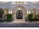 Grand front entrance with lion statues and well-manicured landscaping at 9301 Verlaine Ct, Las Vegas, NV 89145