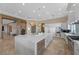 Bright kitchen features marble island, stainless appliances, and white cabinetry for a sleek, modern design at 9301 Verlaine Ct, Las Vegas, NV 89145