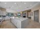 Spacious kitchen with a large marble island, stainless steel appliances, and a beautiful view of the backyard at 9301 Verlaine Ct, Las Vegas, NV 89145
