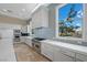 Well-lit kitchen features stainless steel appliances, ample cabinet space, and a large window with neighborhood views at 9301 Verlaine Ct, Las Vegas, NV 89145