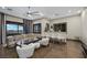 Inviting living room with sleek design, modern wet bar, and city view at 9301 Verlaine Ct, Las Vegas, NV 89145