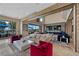 Expansive living room features stylish furniture, large windows with pool views, and elegant decor at 9301 Verlaine Ct, Las Vegas, NV 89145