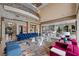 Open-concept living room features high ceilings, designer furnishings, and elegant archways to other rooms at 9301 Verlaine Ct, Las Vegas, NV 89145