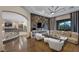Bright and airy living room with modern decor, fireplace, and access to balcony at 9301 Verlaine Ct, Las Vegas, NV 89145