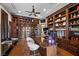 Home office with custom built-ins, a large desk, and ample storage at 9301 Verlaine Ct, Las Vegas, NV 89145