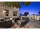 Outdoor patio featuring elegant furniture and views of green space beyond the safety fence at 9301 Verlaine Ct, Las Vegas, NV 89145