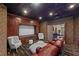 Home theater room features a large projection screen, leather seating, and custom millwork at 9301 Verlaine Ct, Las Vegas, NV 89145