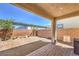 Beautiful backyard featuring decorative brick pavers, a wall, small plants and gravel at 9326 Noble Sage Ave, Las Vegas, NV 89148
