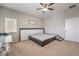 Cozy bedroom showcasing a low-profile bed frame and minimalist decor, enhanced by natural light at 9326 Noble Sage Ave, Las Vegas, NV 89148