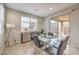 Bright dining room features modern table and chairs with sliding glass door to outdoor patio at 9326 Noble Sage Ave, Las Vegas, NV 89148