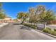 Ridgehaven gated community entrance with lush landscaping and mature trees, located in a desirable neighborhood at 9326 Noble Sage Ave, Las Vegas, NV 89148