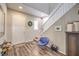 Bright entryway features wood floors, a staircase, and neutral decor at 9326 Noble Sage Ave, Las Vegas, NV 89148