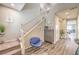 Spacious entryway showcasing the staircase, modern flooring, and stylish decor at 9326 Noble Sage Ave, Las Vegas, NV 89148