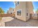 The home has a landscaped side yard, brick pavers, and a block wall around the backyard at 9326 Noble Sage Ave, Las Vegas, NV 89148