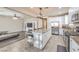Open concept kitchen with granite countertops, stainless steel appliances, and large center island at 9326 Noble Sage Ave, Las Vegas, NV 89148